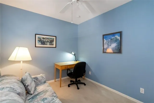 a workspace with furniture and a window