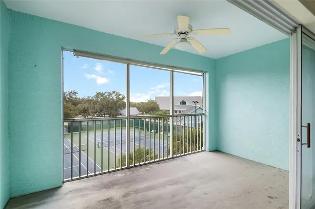 a view of a balcony with a ceiling fan