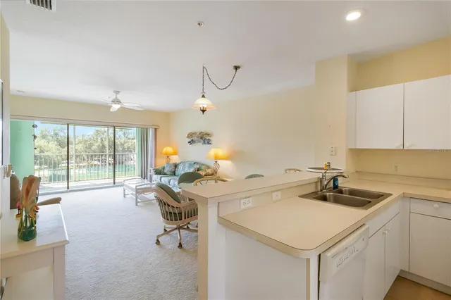 a room with a sink and cabinets