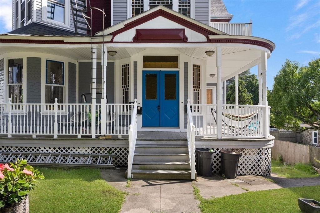 311 Elm Street Woonsocket, RI 02895 - Photo 5 of 29 front view of a house with a yard