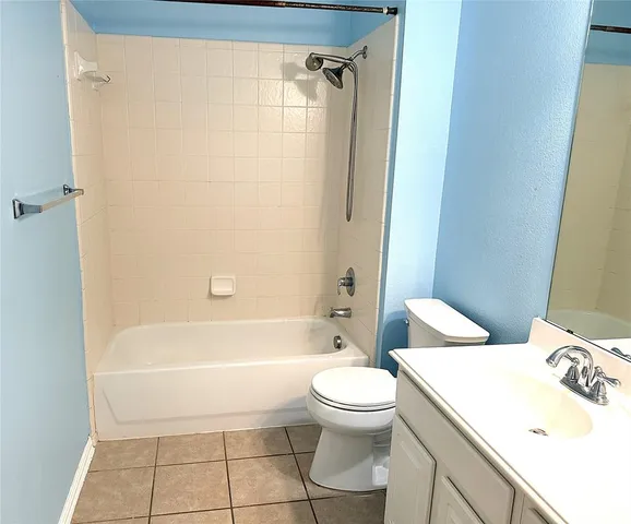 a bathroom with a toilet a sink and bathtub