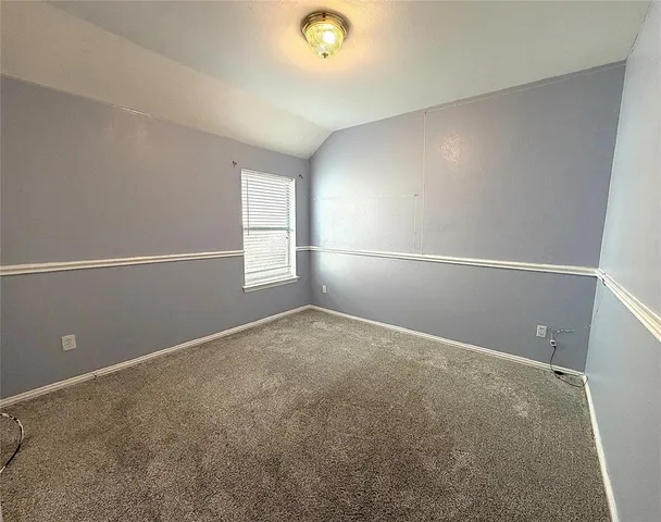 a view of an empty room with window