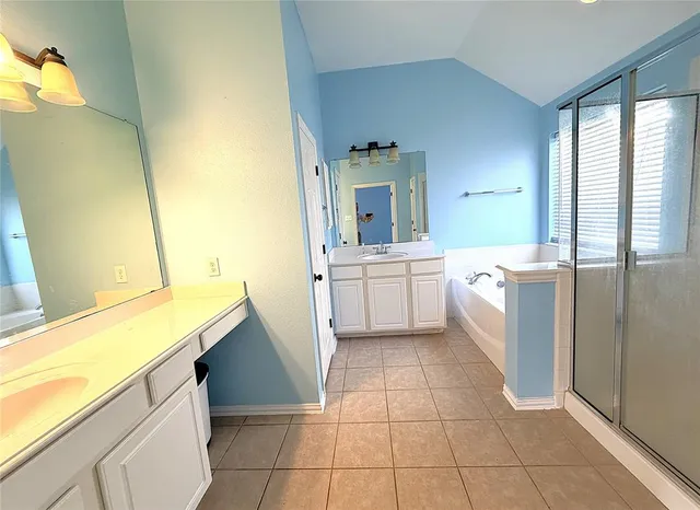 a kitchen with a sink a stove top oven and cabinets