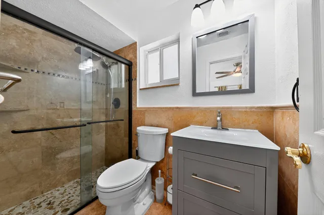 a bathroom with a sink toilet and vanity