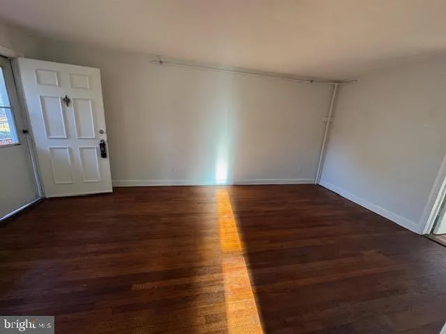 a view of a room with wooden floors and led lights