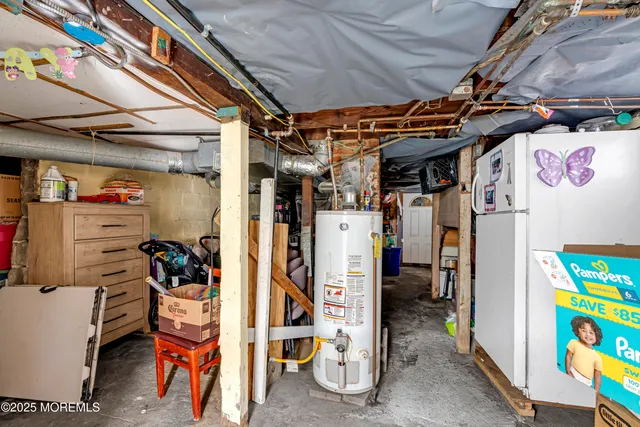 a view of walk in closet with clothes