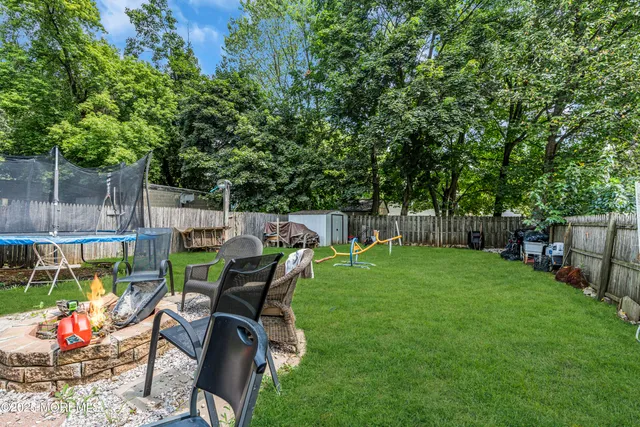 a view of a backyard with sitting area and furniture