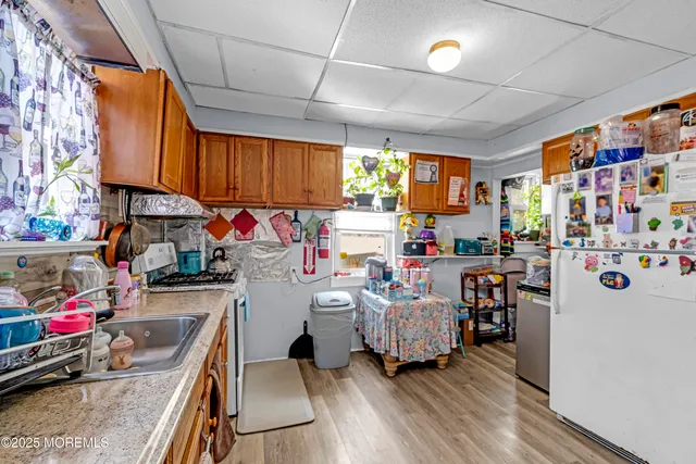 a view of a kitchen with furniture and a window