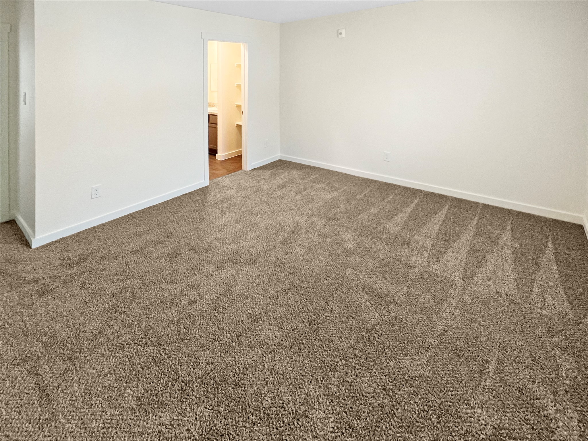 12603 Telge Road, Unit 8EH Cypress, TX 77429 - Photo 14 of 32 an empty room with an entryway