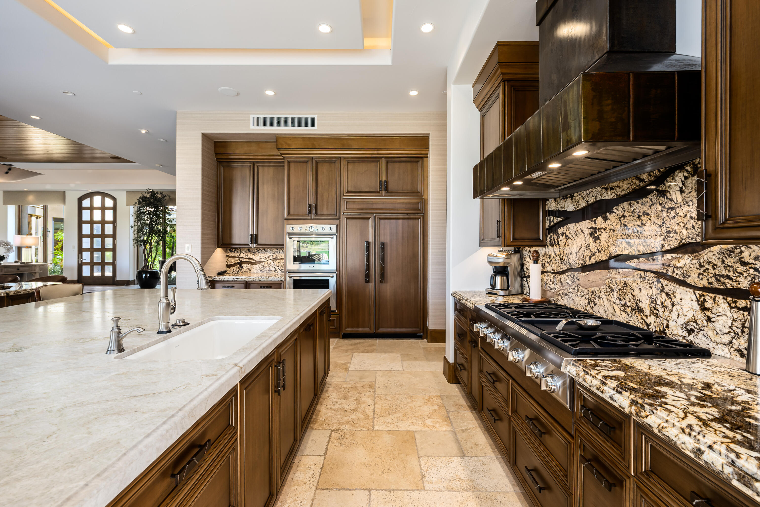 52711 Via Dona La Quinta, CA 92253 - Photo 15 of 61 a kitchen with stainless steel appliances granite countertop a stove and a sink