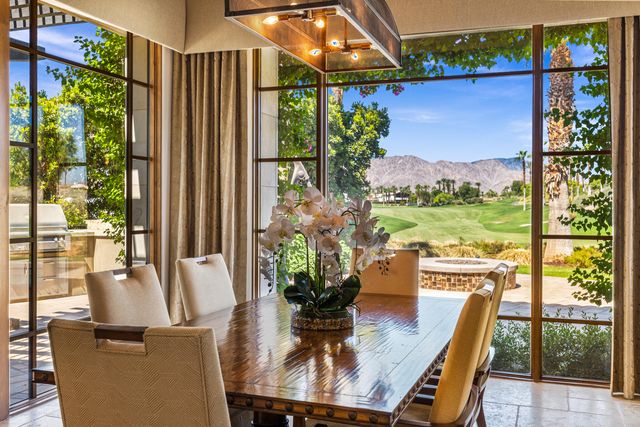 a kitchen with a sink and a stove top oven