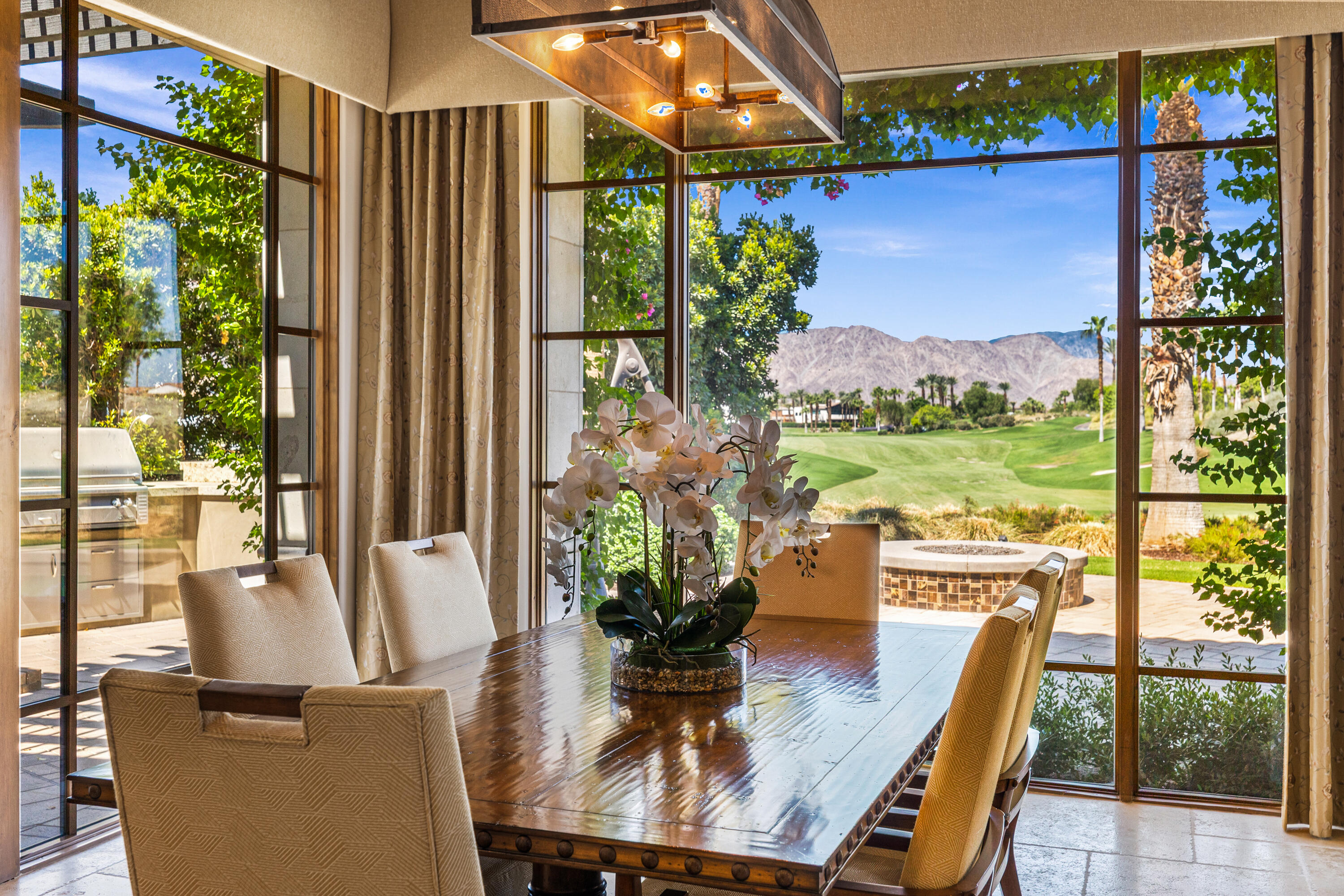 52711 Via Dona La Quinta, CA 92253 - Photo 22 of 61 a view of a dining room with furniture window and outside view