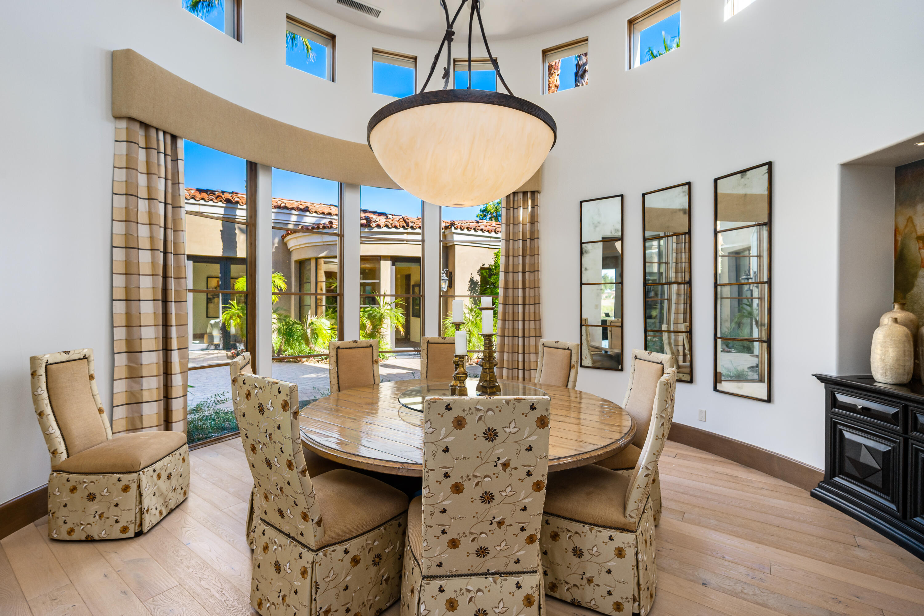 52711 Via Dona La Quinta, CA 92253 - Photo 23 of 61 a dining room with furniture a chandelier and wooden floor