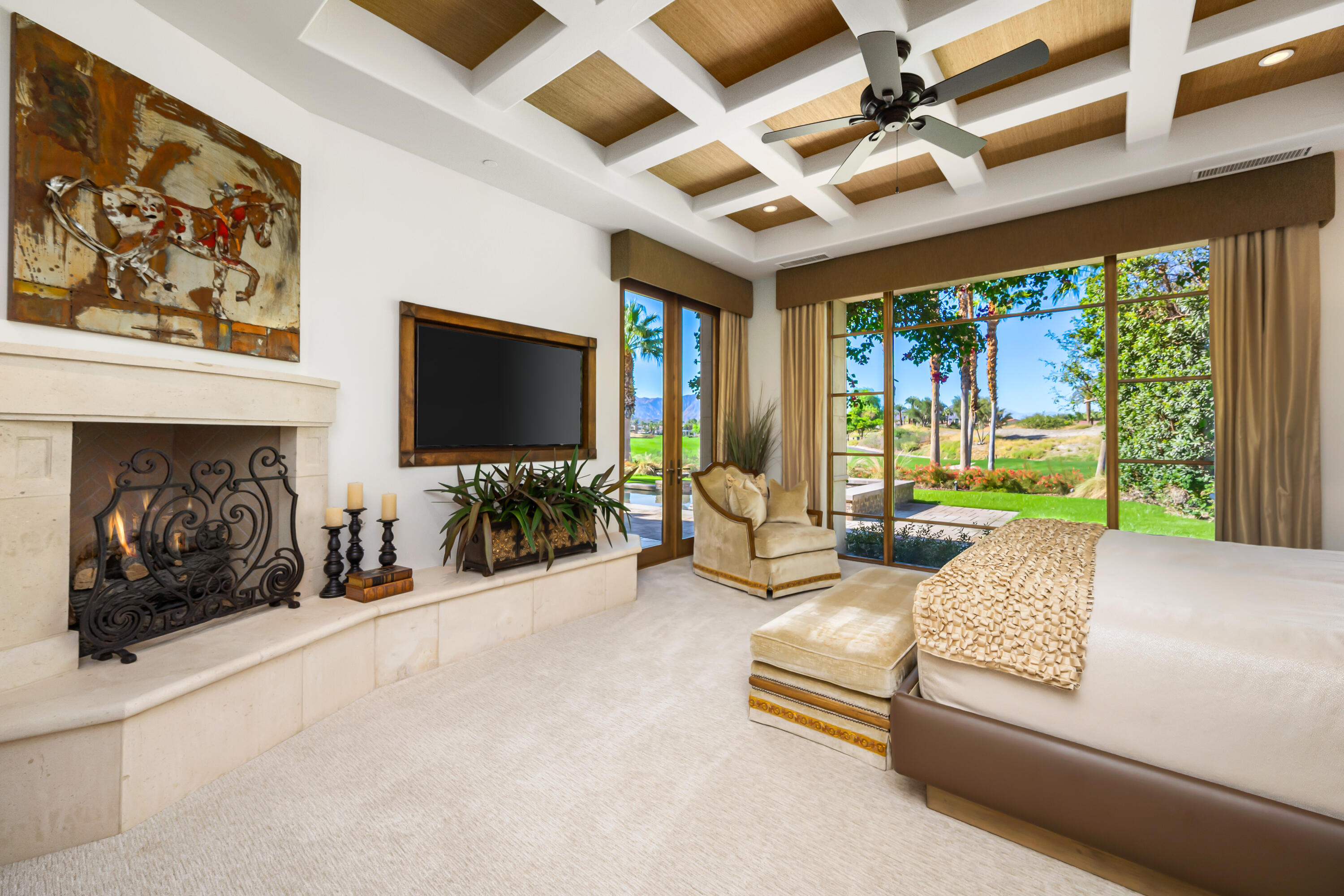 52711 Via Dona La Quinta, CA 92253 - Photo 29 of 61 a living room with furniture a flat screen tv and a large window