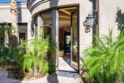 a front view of a building with garden