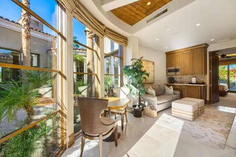 a living room with fireplace furniture and a flat screen tv