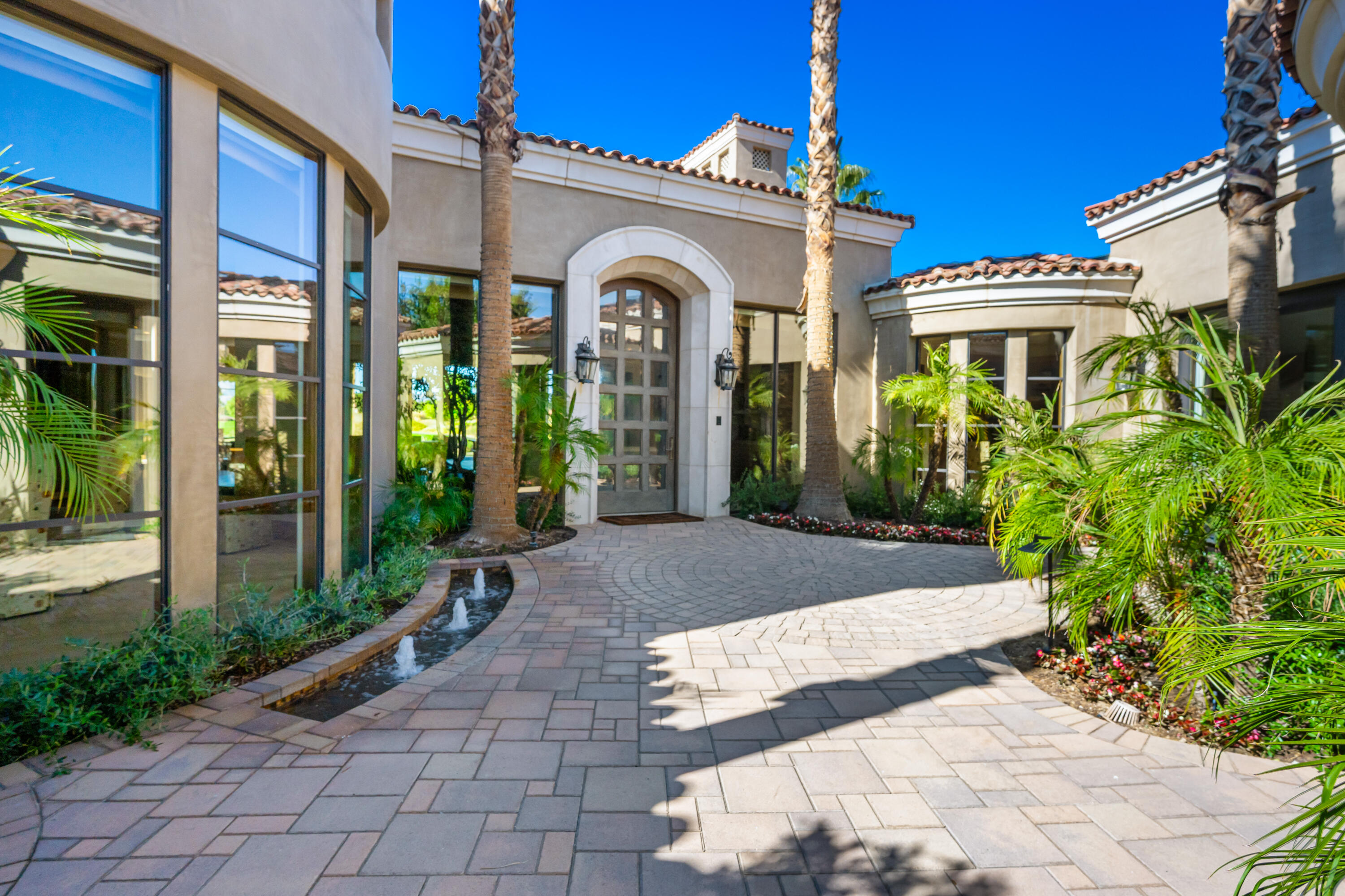 52711 Via Dona La Quinta, CA 92253 - Photo 4 of 61 a view of a brick house with potted plants