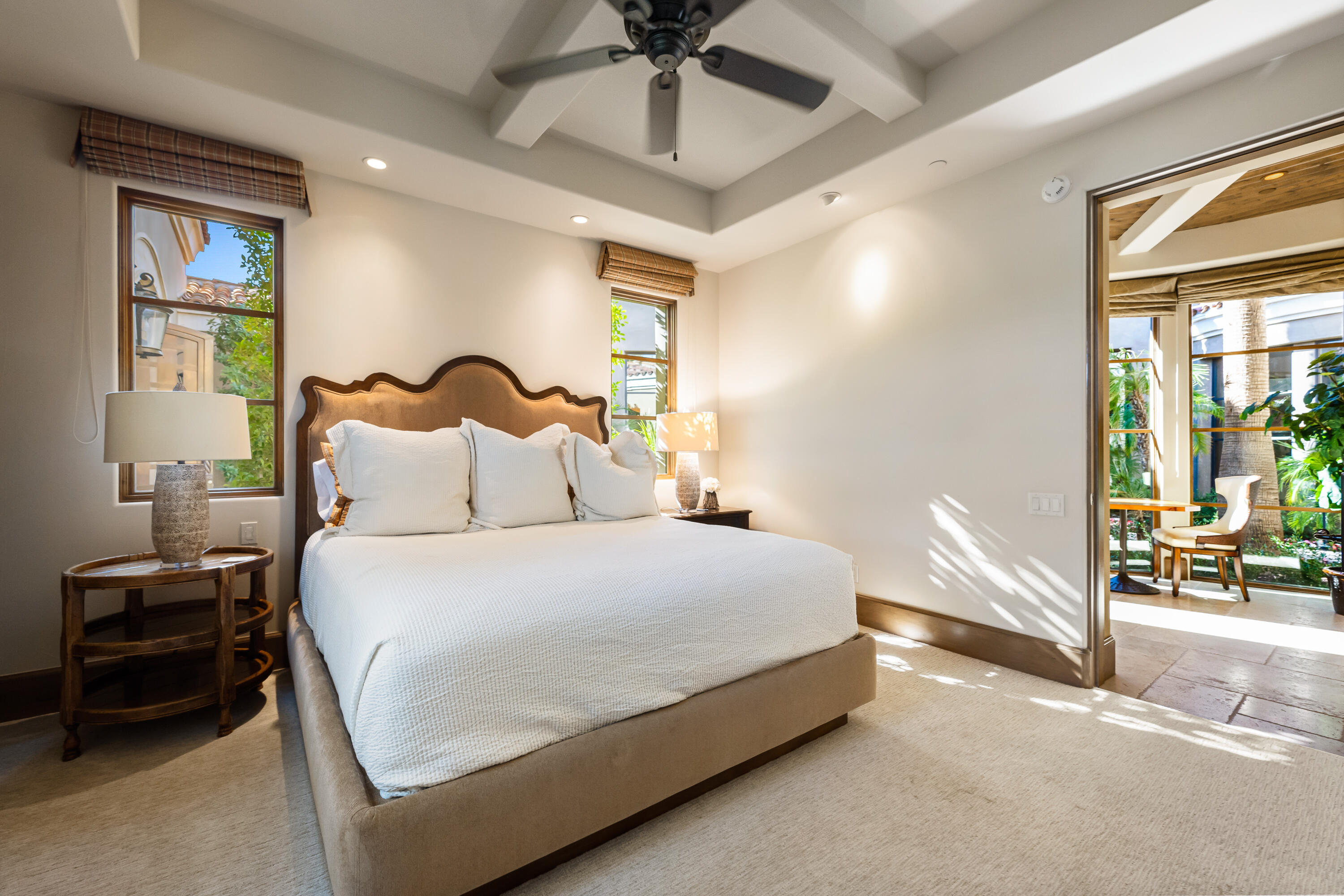 52711 Via Dona La Quinta, CA 92253 - Photo 43 of 61 a bedroom with a bed and a chandelier