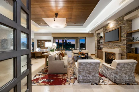 a view of a house with backyard outdoor seating area and swimming pool