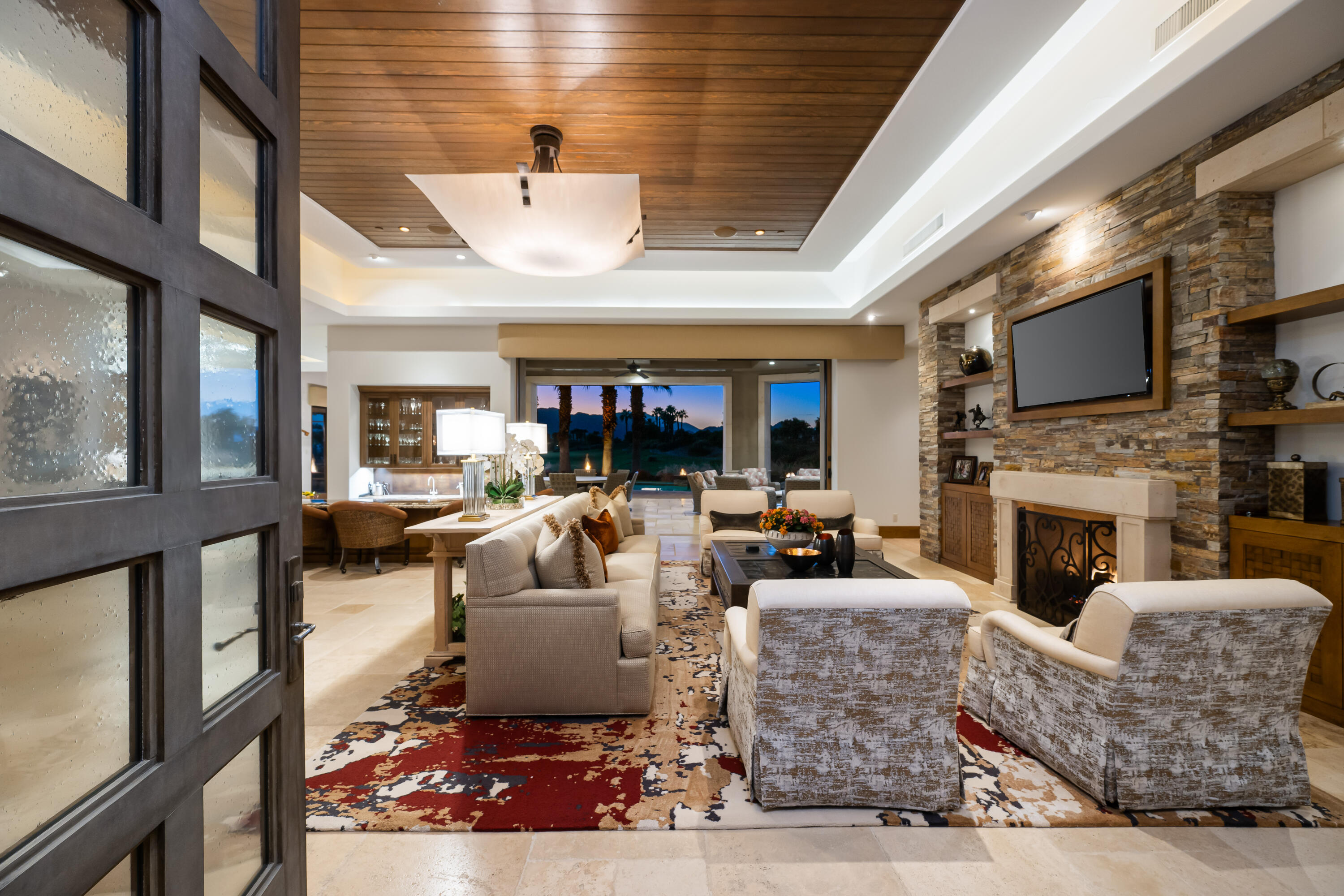 52711 Via Dona La Quinta, CA 92253 - Photo 46 of 61 a living room with fireplace furniture and a flat screen tv