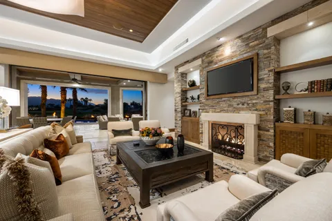 a view of a house with swimming pool patio and a yard