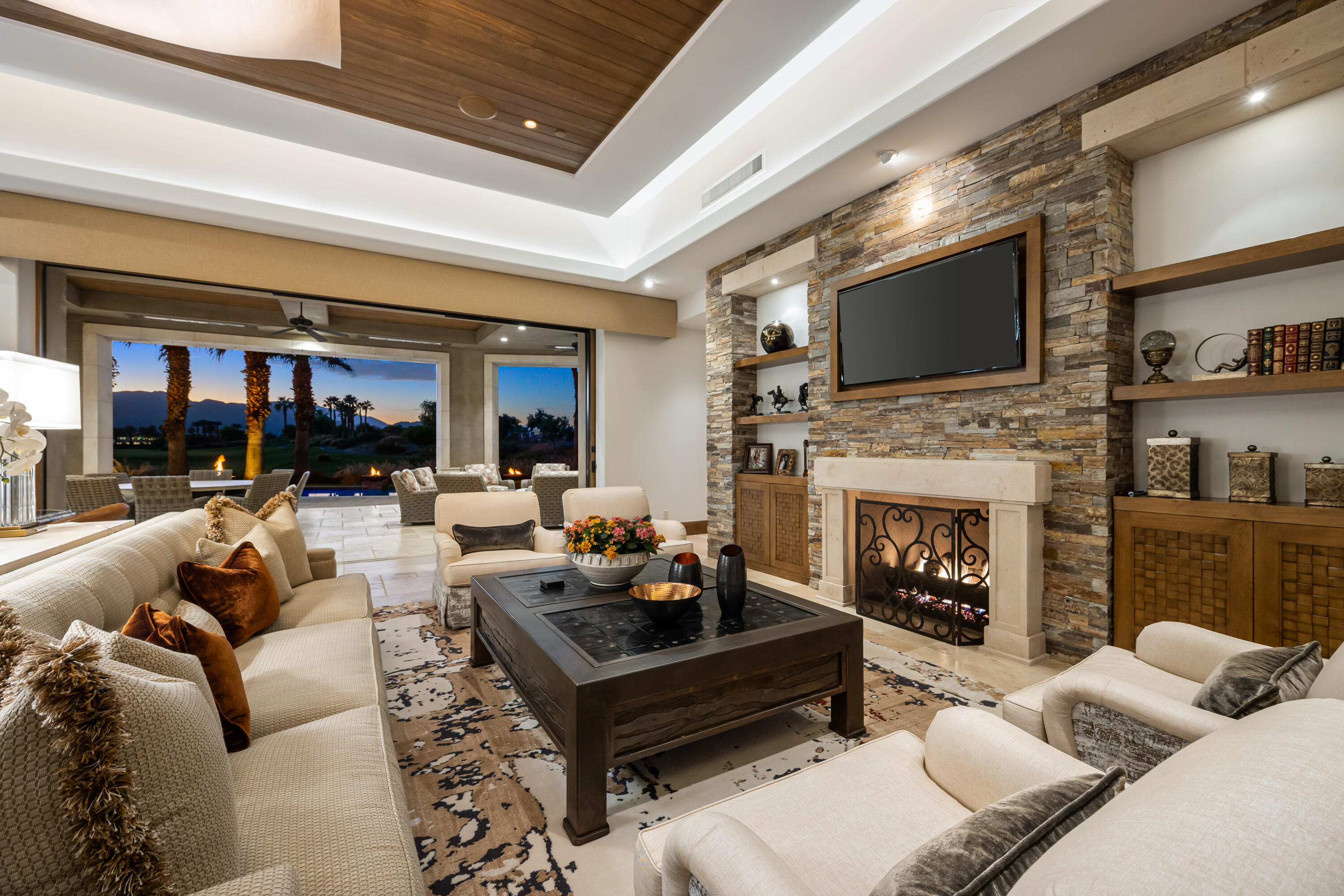 52711 Via Dona La Quinta, CA 92253 - Photo 47 of 61 a living room with furniture a fireplace and a flat screen tv