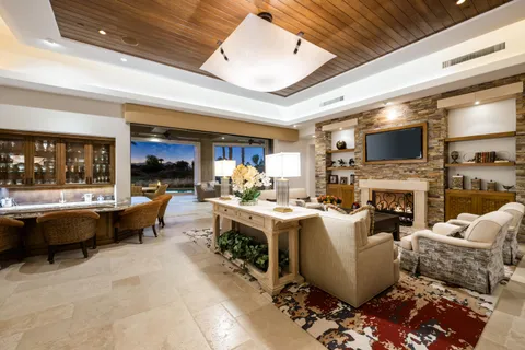 a view of a house with backyard and patio