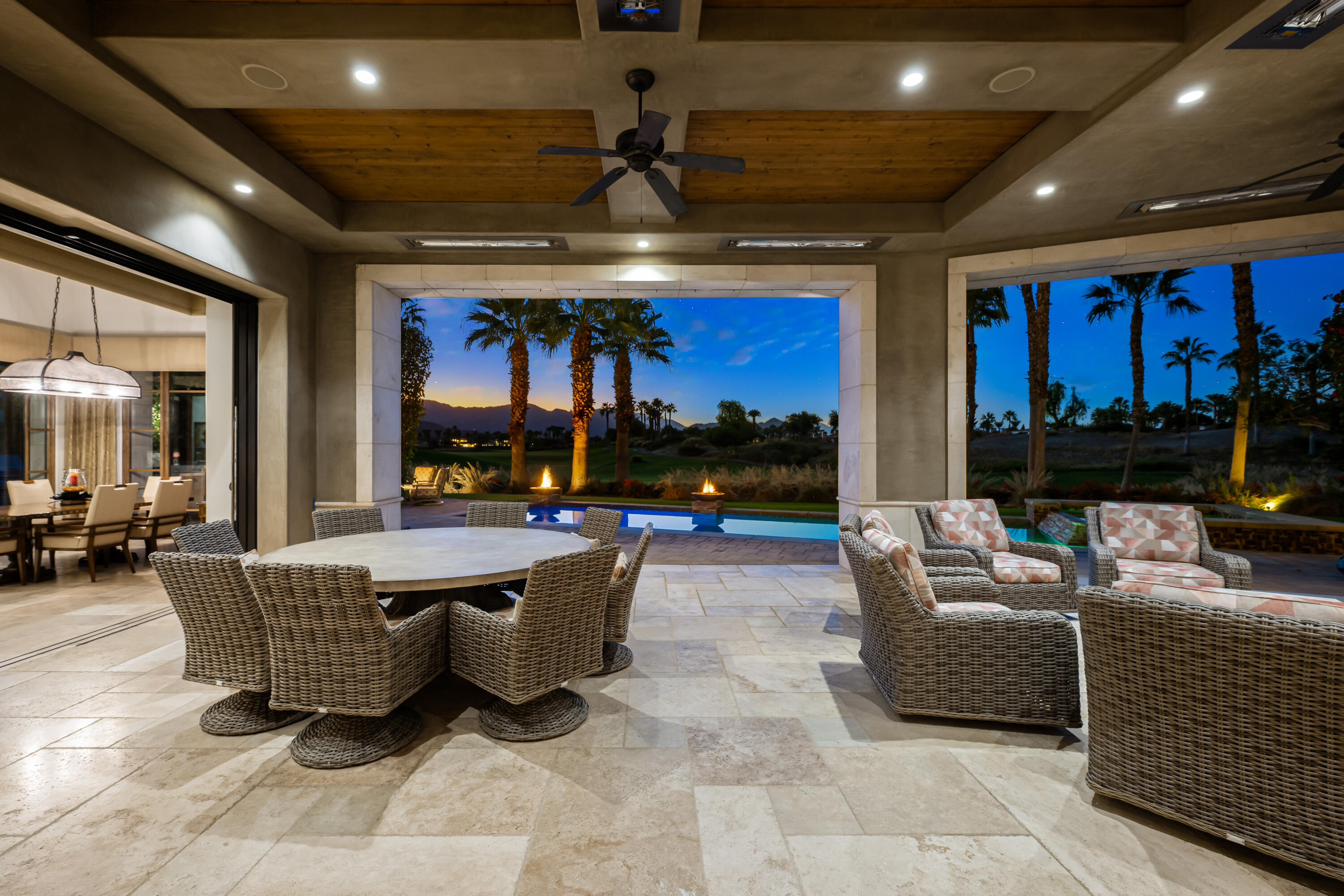 52711 Via Dona La Quinta, CA 92253 - Photo 50 of 61 a living room with furniture a fireplace and a chandelier
