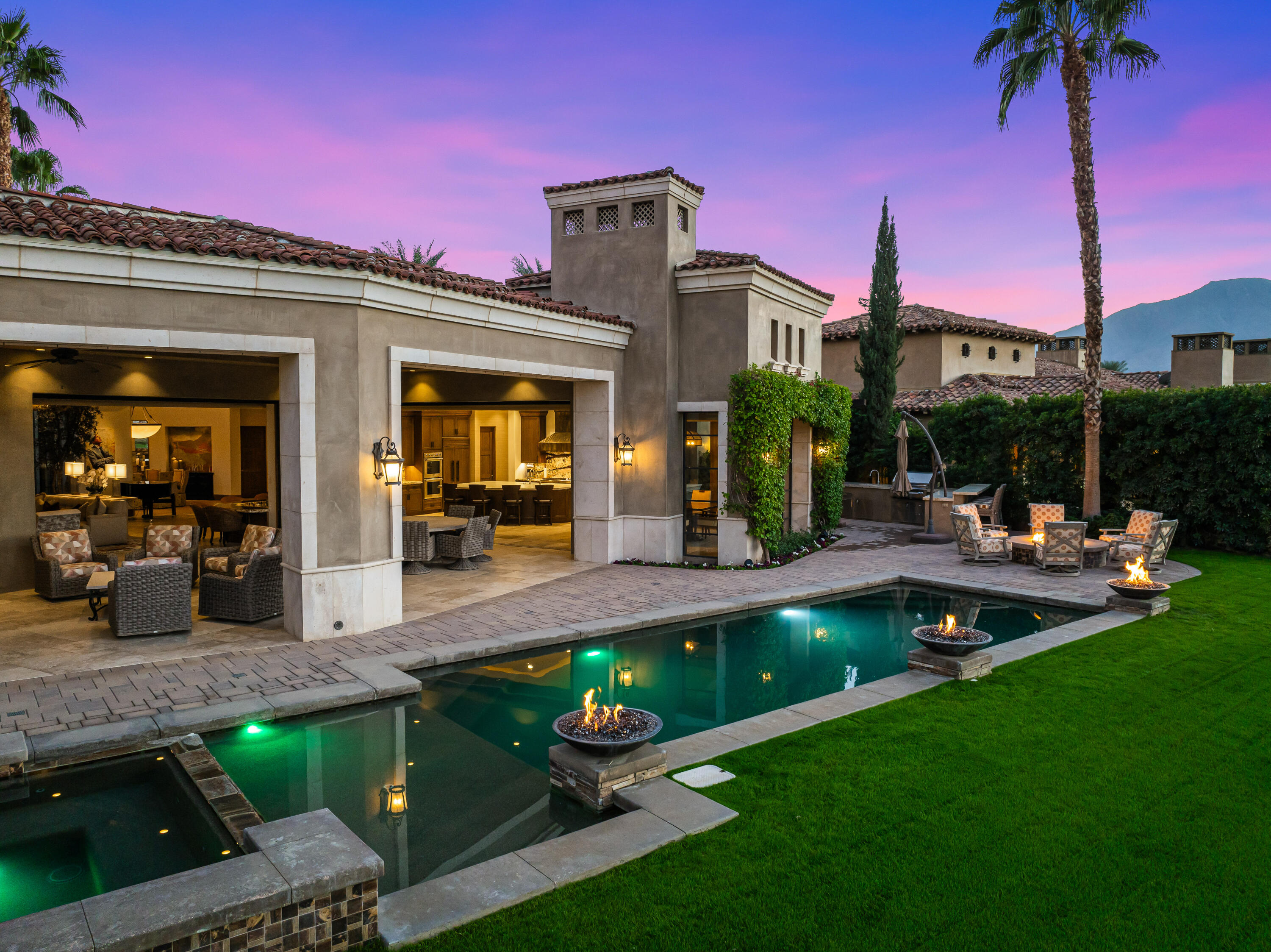 52711 Via Dona La Quinta, CA 92253 - Photo 54 of 61 a front view of a house with swimming pool having outdoor seating