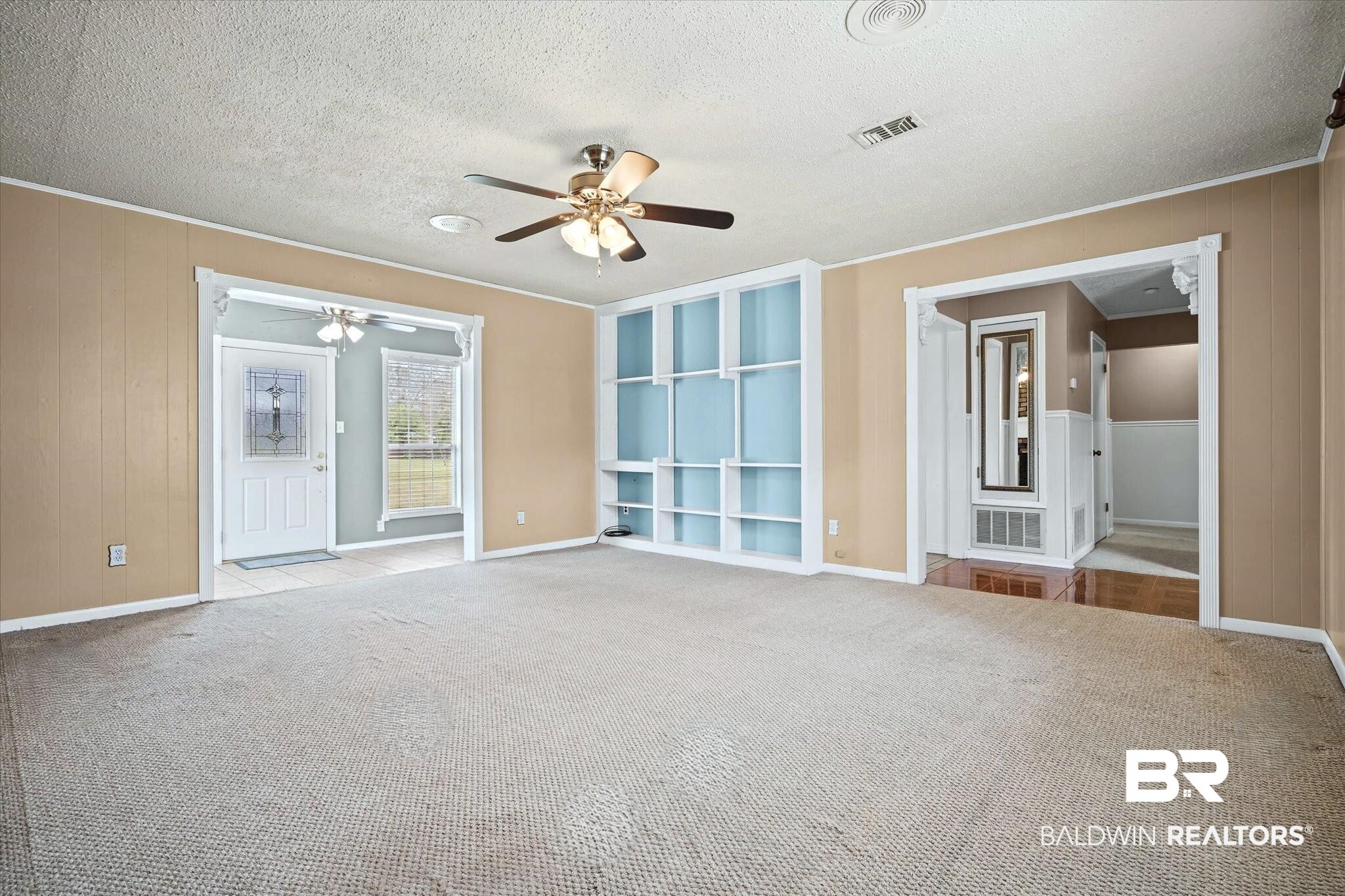 8090 Murray Hill Road Irvington, AL 36544 - Photo 10 of 40 Living Room with view of built ins, sunroom and hall