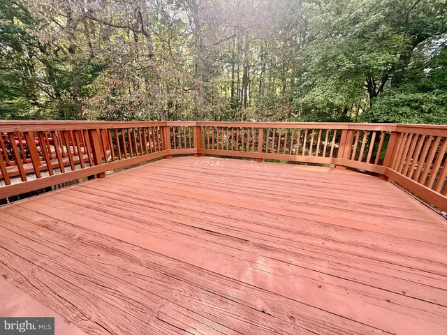 a view of deck with wooden floor and fence