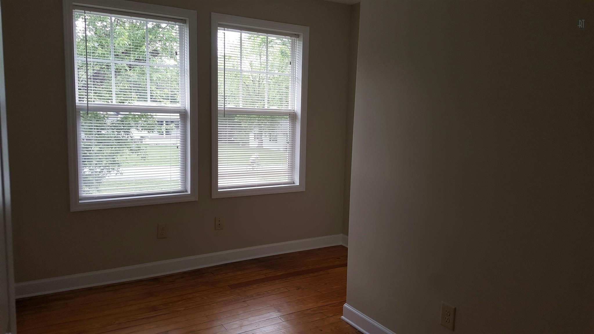 1102 Fowler Street Old Hickory, TN 37138 - Photo 11 of 13 a view of an empty room with wooden floor and a window
