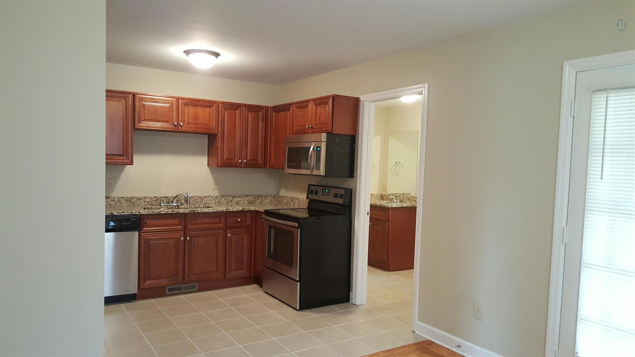 1102 Fowler Street Old Hickory, TN 37138 - Photo 3 of 13 a kitchen with stainless steel appliances granite countertop a refrigerator and a stove