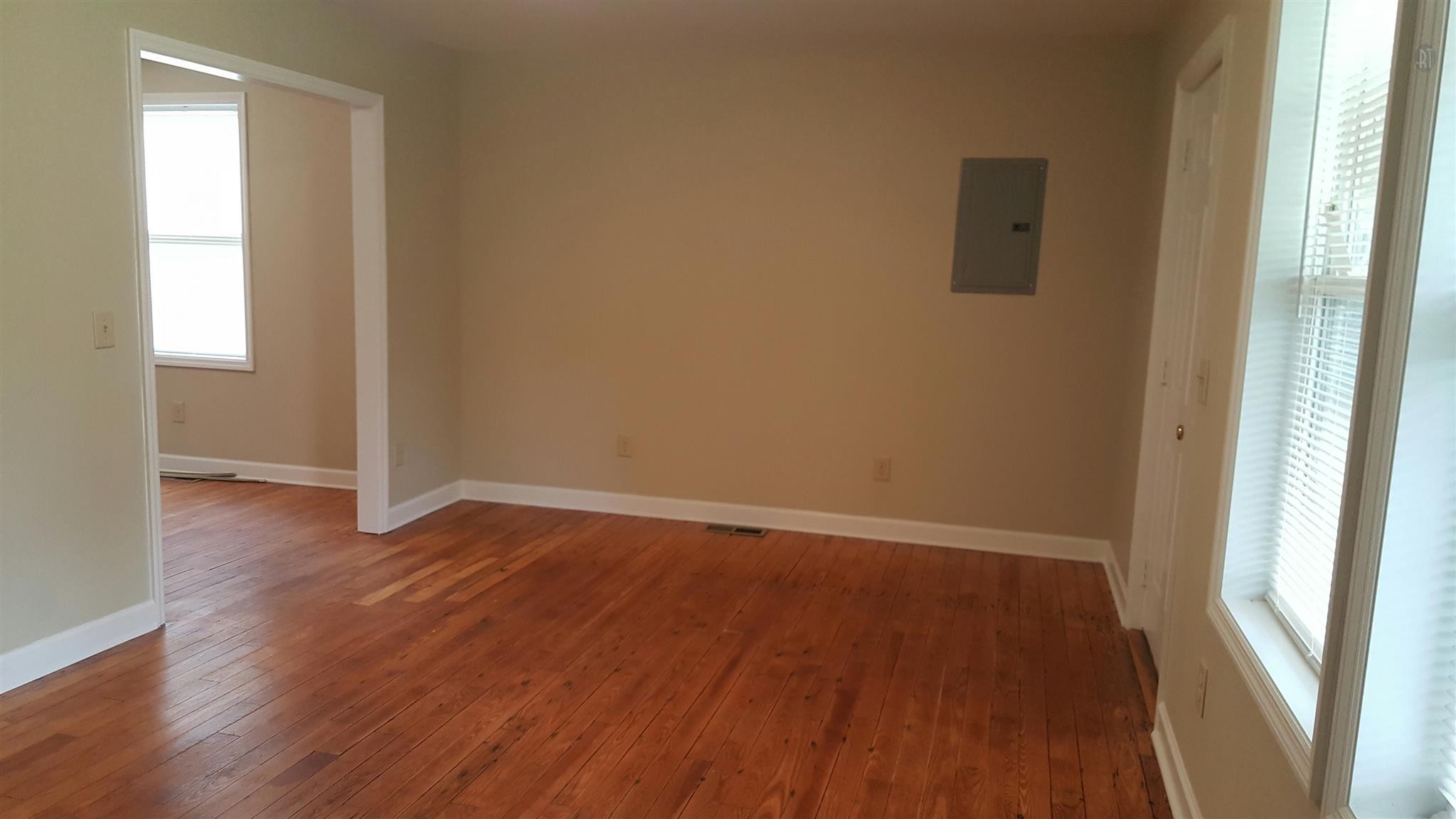 1102 Fowler Street Old Hickory, TN 37138 - Photo 6 of 13 an empty room with wooden floor and windows