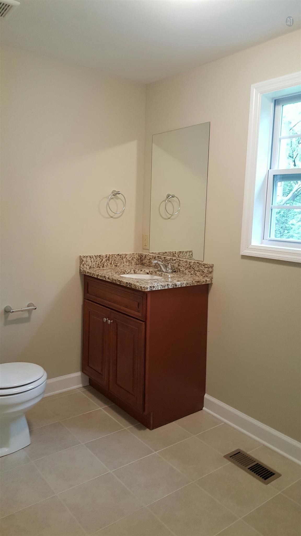 1102 Fowler Street Old Hickory, TN 37138 - Photo 7 of 13 a bathroom with a granite countertop sink a toilet and a window