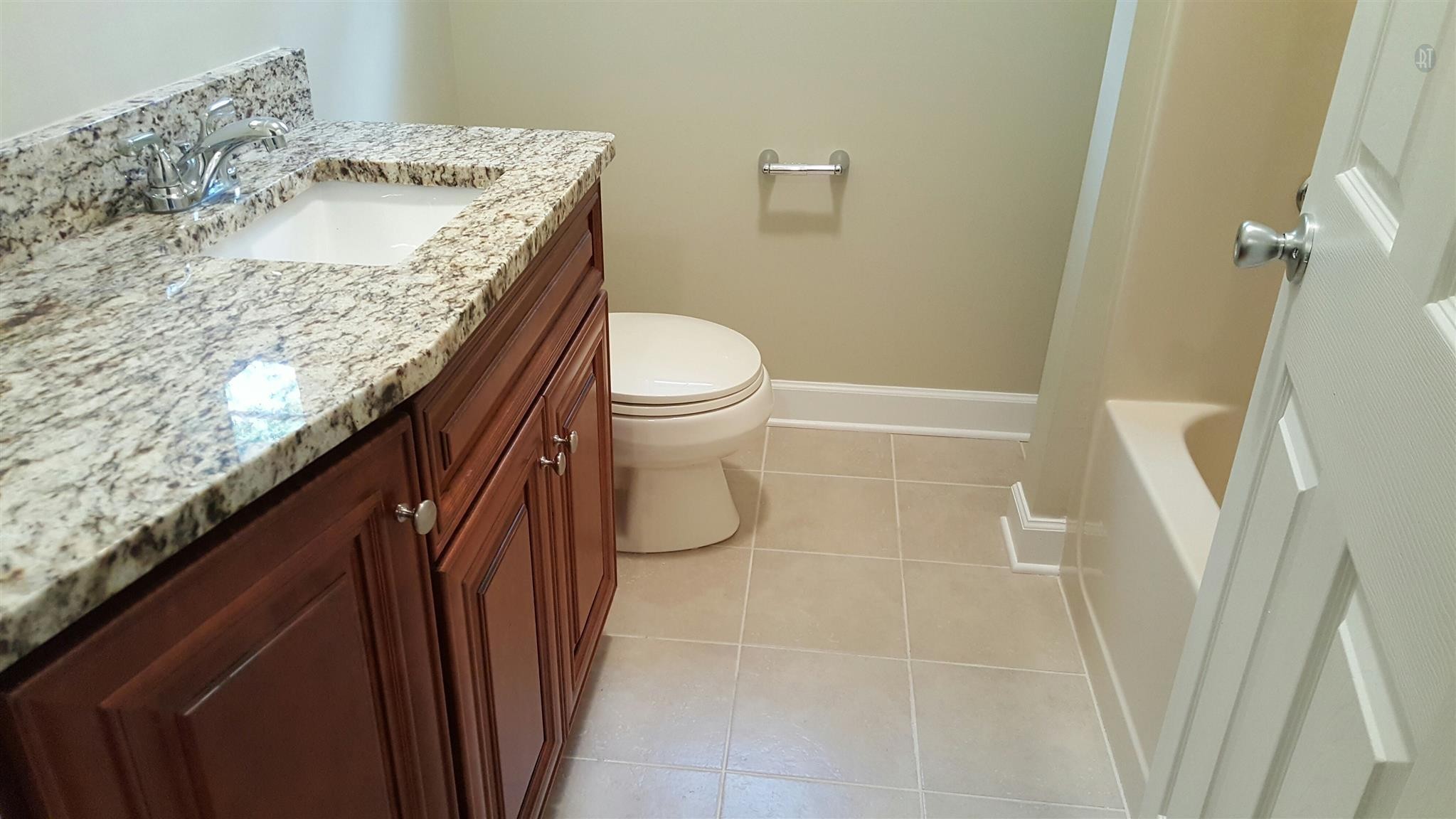 1102 Fowler Street Old Hickory, TN 37138 - Photo 9 of 13 a bathroom with a granite countertop sink and a toilet