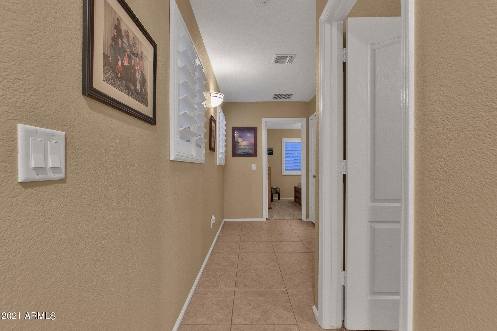 42726 West Venture Road Maricopa, AZ 85138 - Photo 27 of 45 Hallway to secondary bedrooms