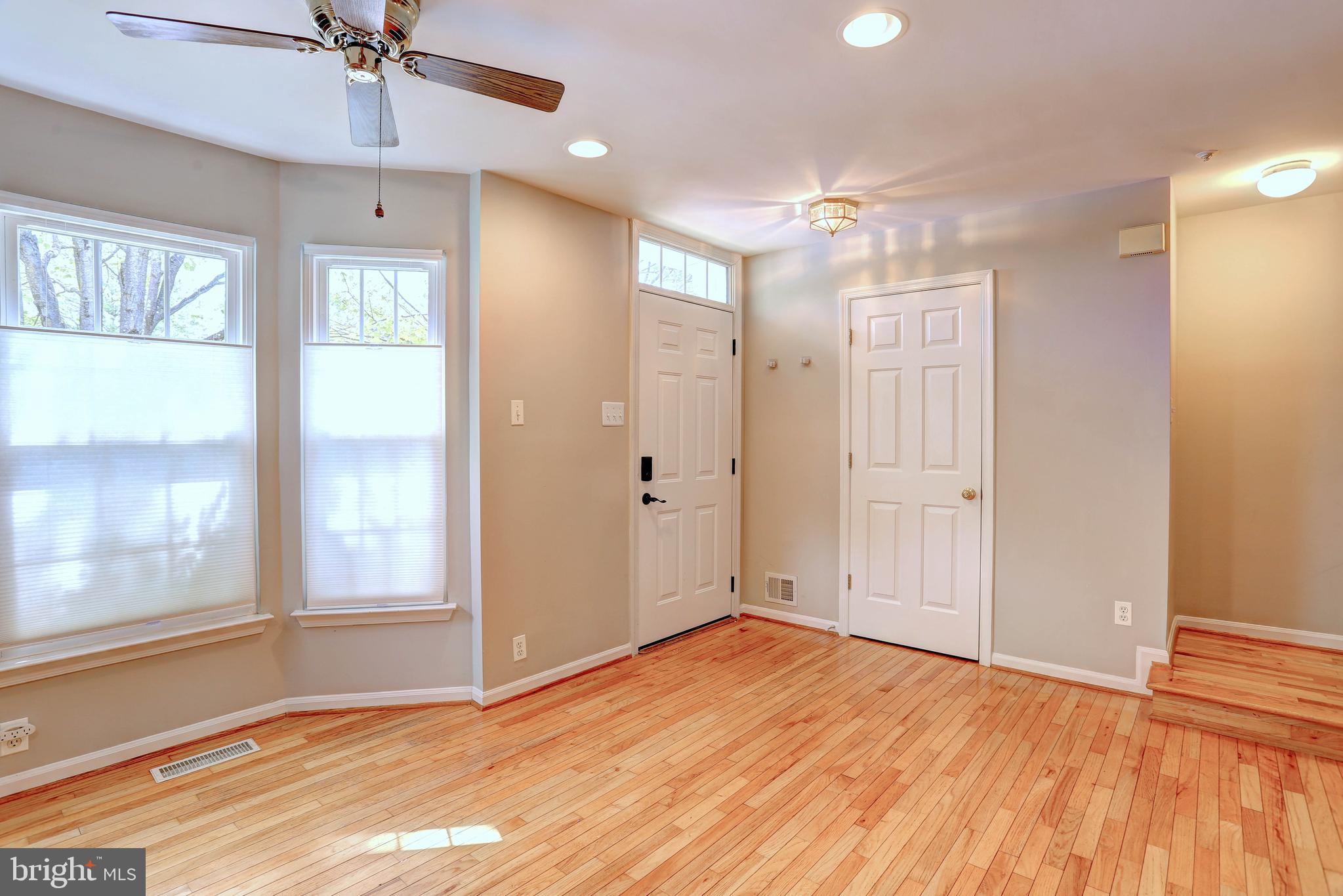6136 Starburn Path Columbia, MD 21045 - Photo 6 of 35 a view of an empty room with a window