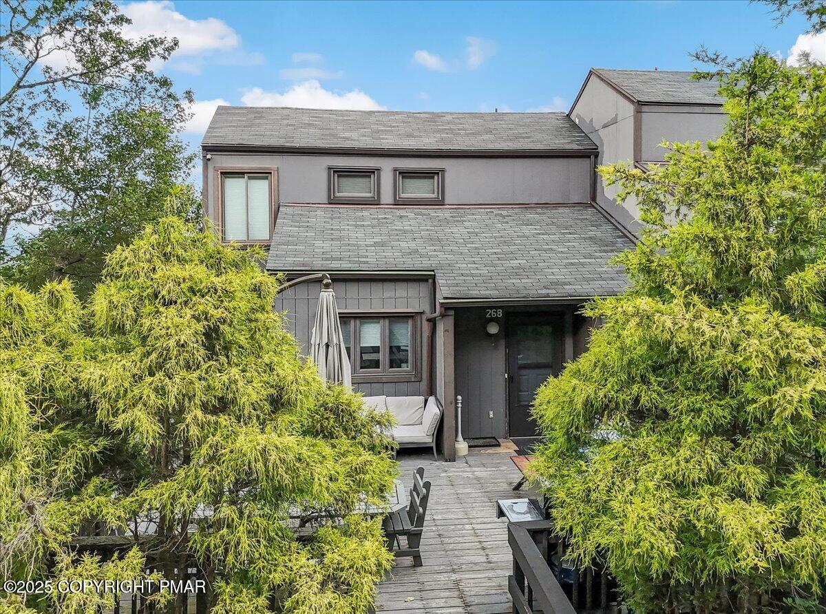 268 Big Pocono Pass Tannersville, PA 18372 - Photo 2 of 66 a front view of a house with a yard and potted plants