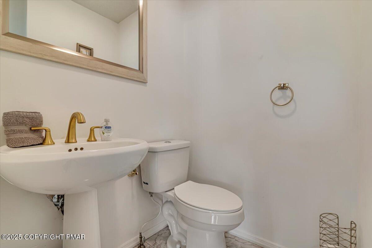 268 Big Pocono Pass Tannersville, PA 18372 - Photo 24 of 66 a bathroom with a sink a toilet and mirror
