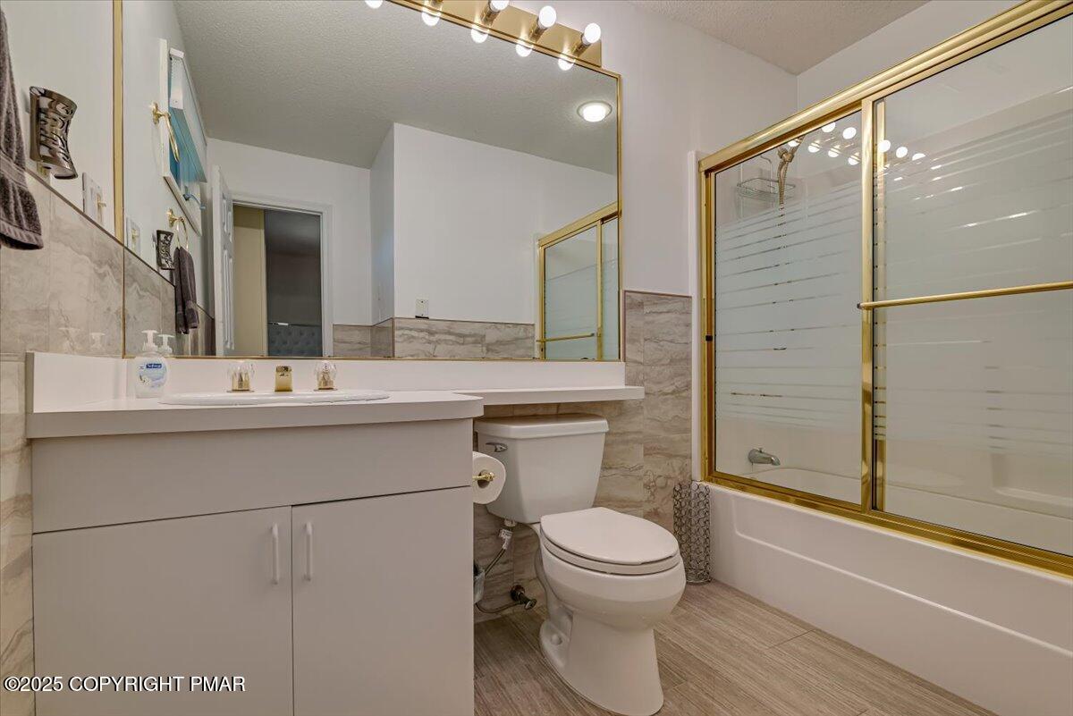 268 Big Pocono Pass Tannersville, PA 18372 - Photo 34 of 66 a bathroom with a sink a toilet and shower