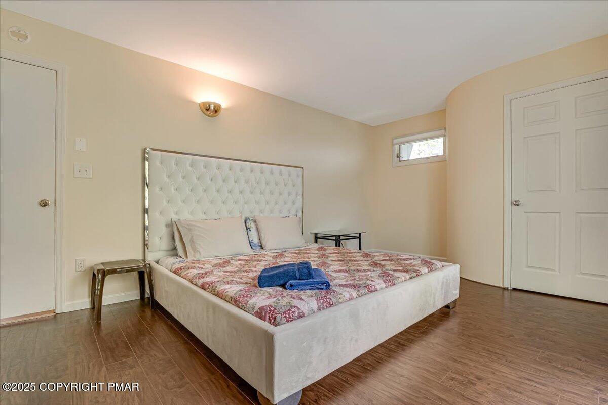 268 Big Pocono Pass Tannersville, PA 18372 - Photo 39 of 66 a living room with a bed and a table