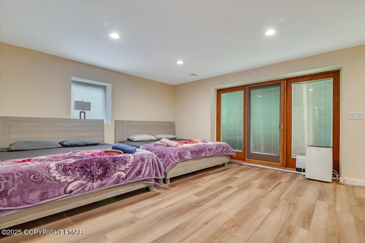 268 Big Pocono Pass Tannersville, PA 18372 - Photo 42 of 66 a bedroom with a bed and a large window