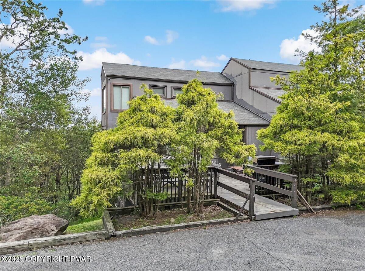 268 Big Pocono Pass Tannersville, PA 18372 - Photo 48 of 66 a wooden bench sitting in front of a building