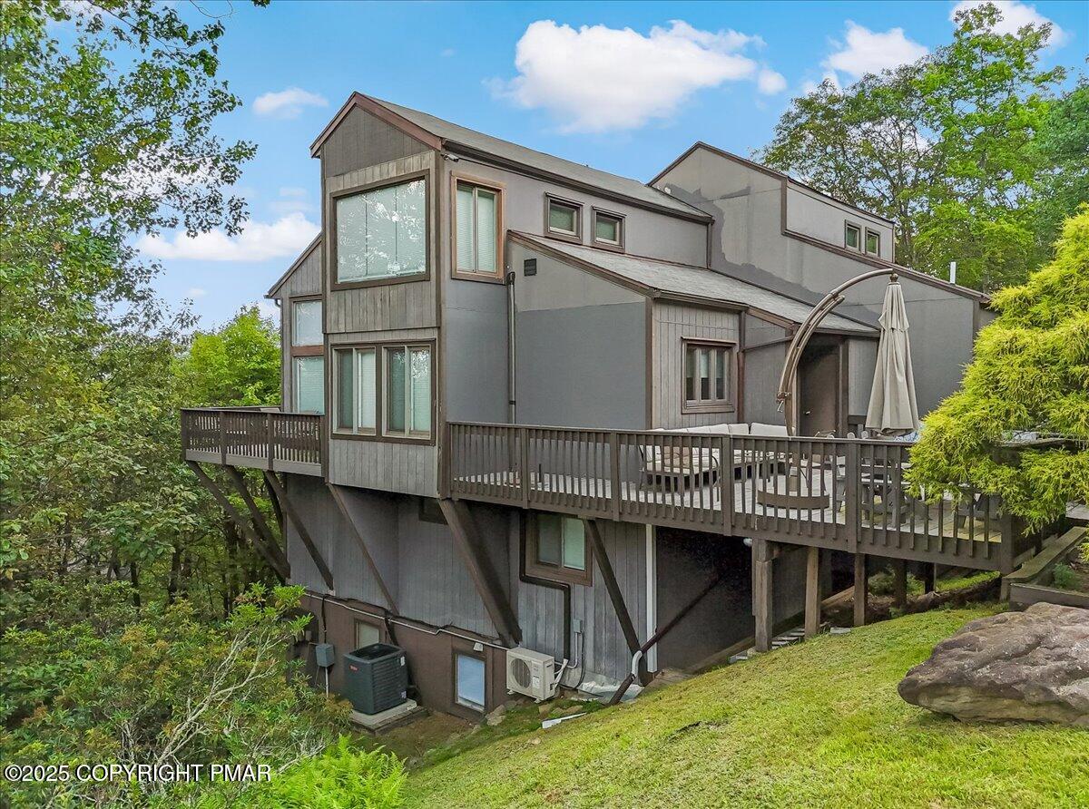 268 Big Pocono Pass Tannersville, PA 18372 - Photo 51 of 66 a view of a house with a deck and a yard