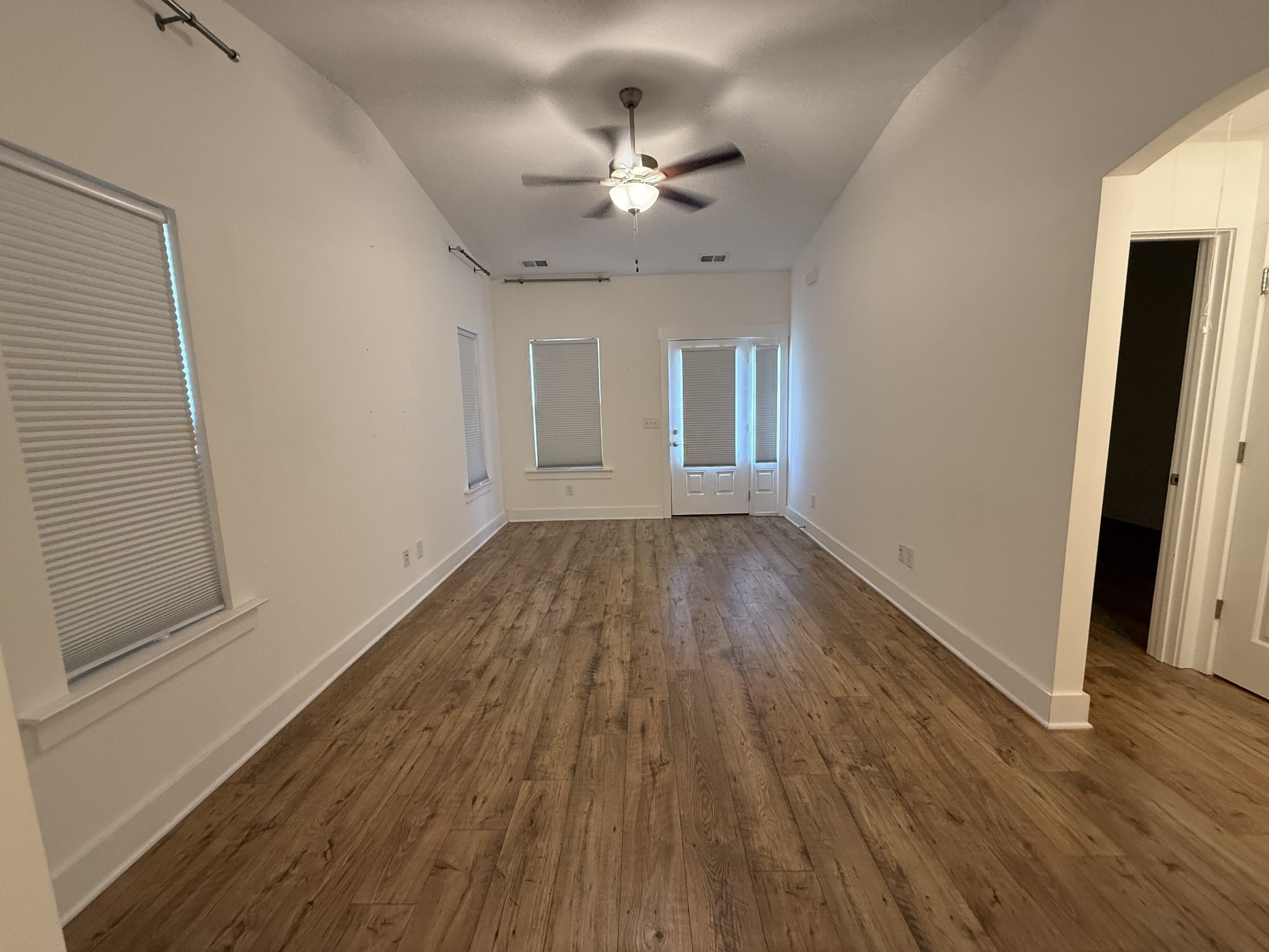 400 Buchanan Court Columbia, TN 38401 - Photo 11 of 21 wooden floor in an empty room with a window