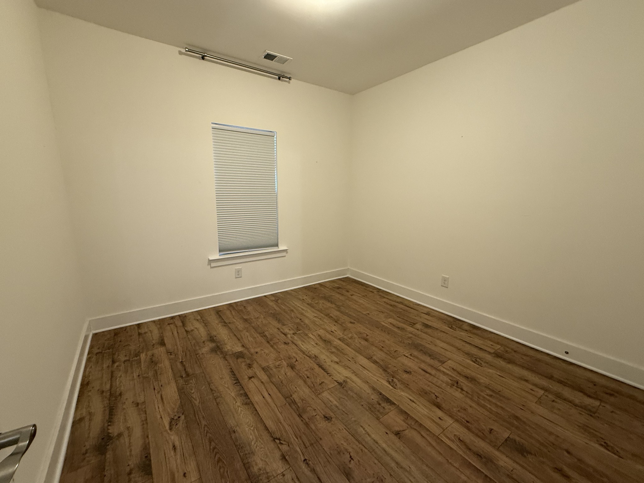 400 Buchanan Court Columbia, TN 38401 - Photo 4 of 21 a view of a room with wooden floor and white walls
