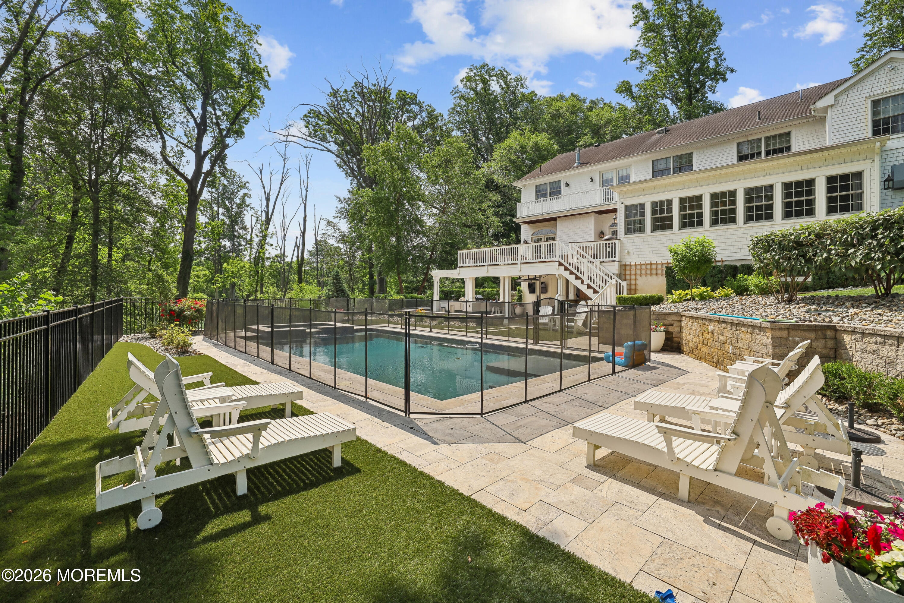92 Tulip Lane Colts Neck, NJ 07722 - Photo 43 of 55 a view of a house with pool and chairs