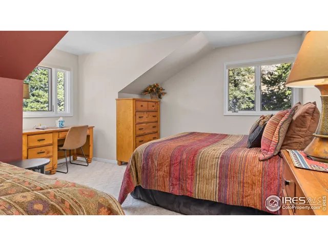 a bedroom with a bed and chair