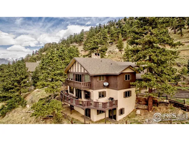 a aerial view of a house with a yard